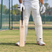 SS Ton Special Edition English Willow Cricket Bat - SH held upright by a cricketer before practice
