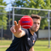 Tennex hard red cricket tennis ball in a bowling release drill