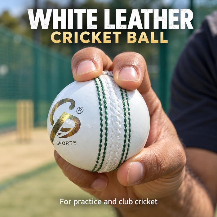 White leather cricket ball with green stitching held in a seam grip