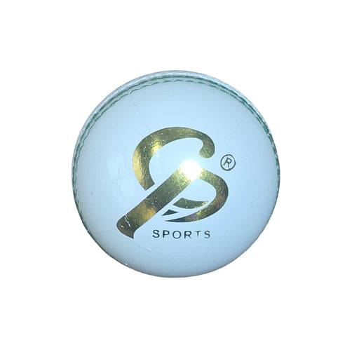 White leather cricket ball with gold logo and green stitching